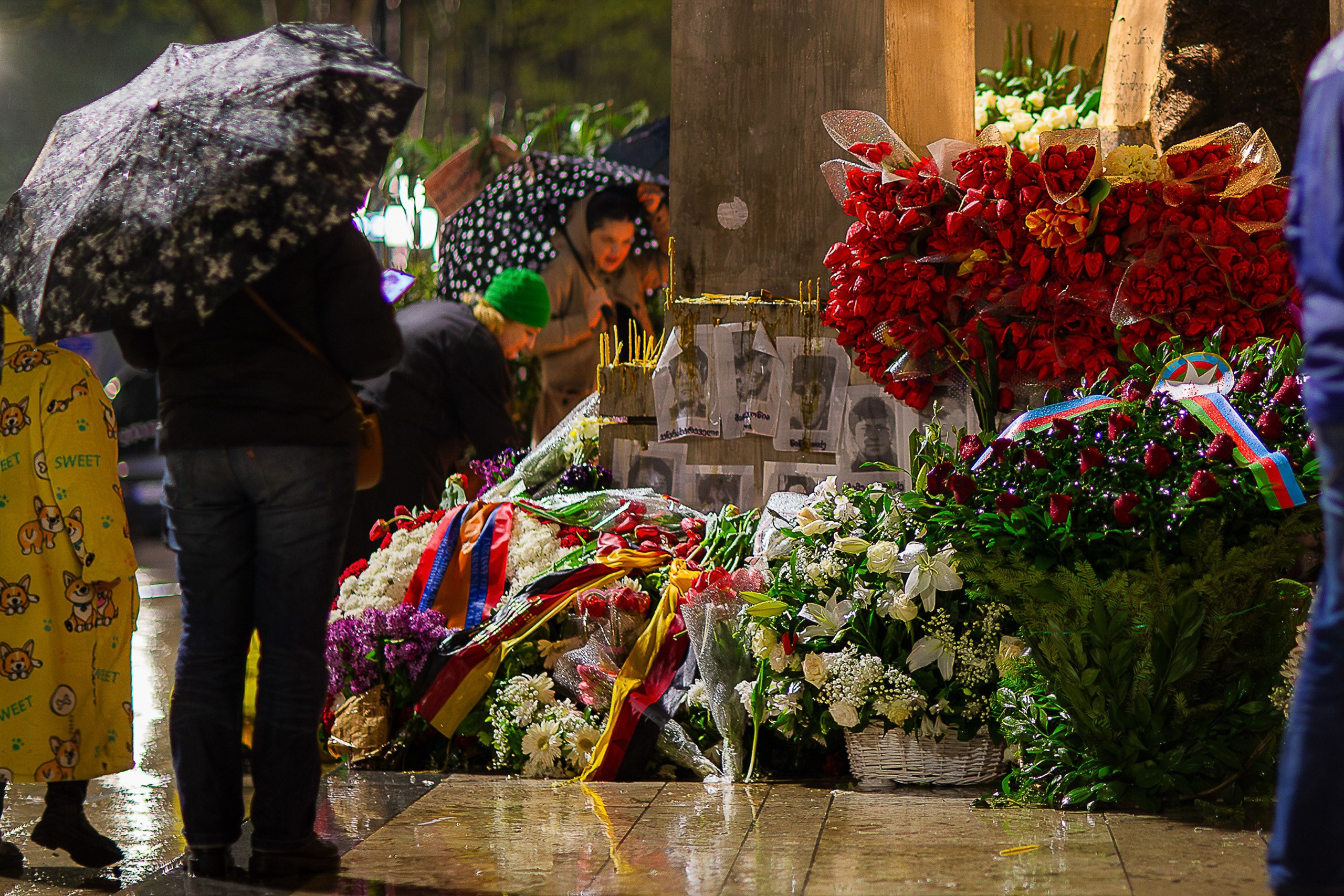 Lit candles at April 9 memorial monument in Tbilisi, 2025