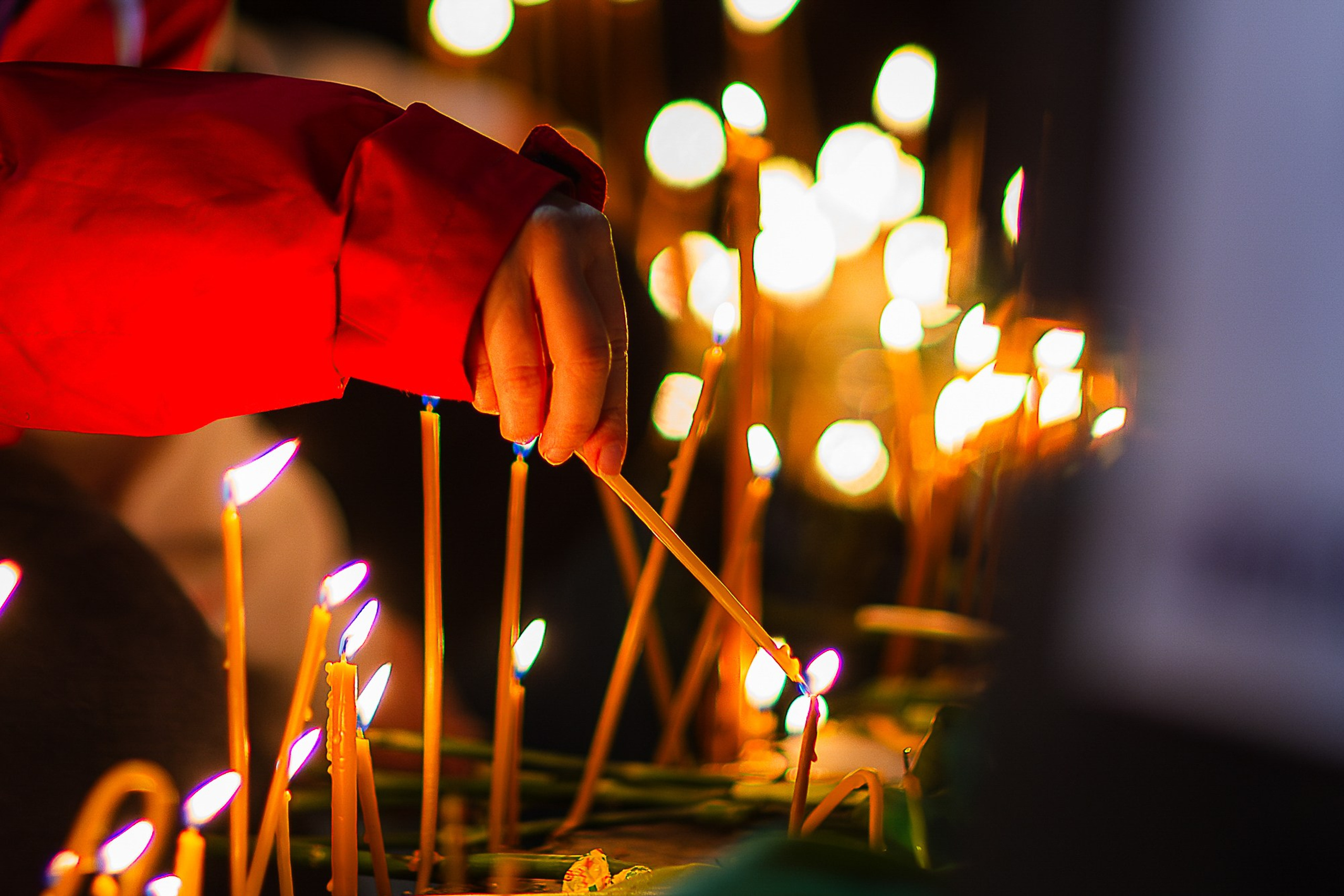 People with flowers and candles at April 9 memorial, Tbilisi 2025