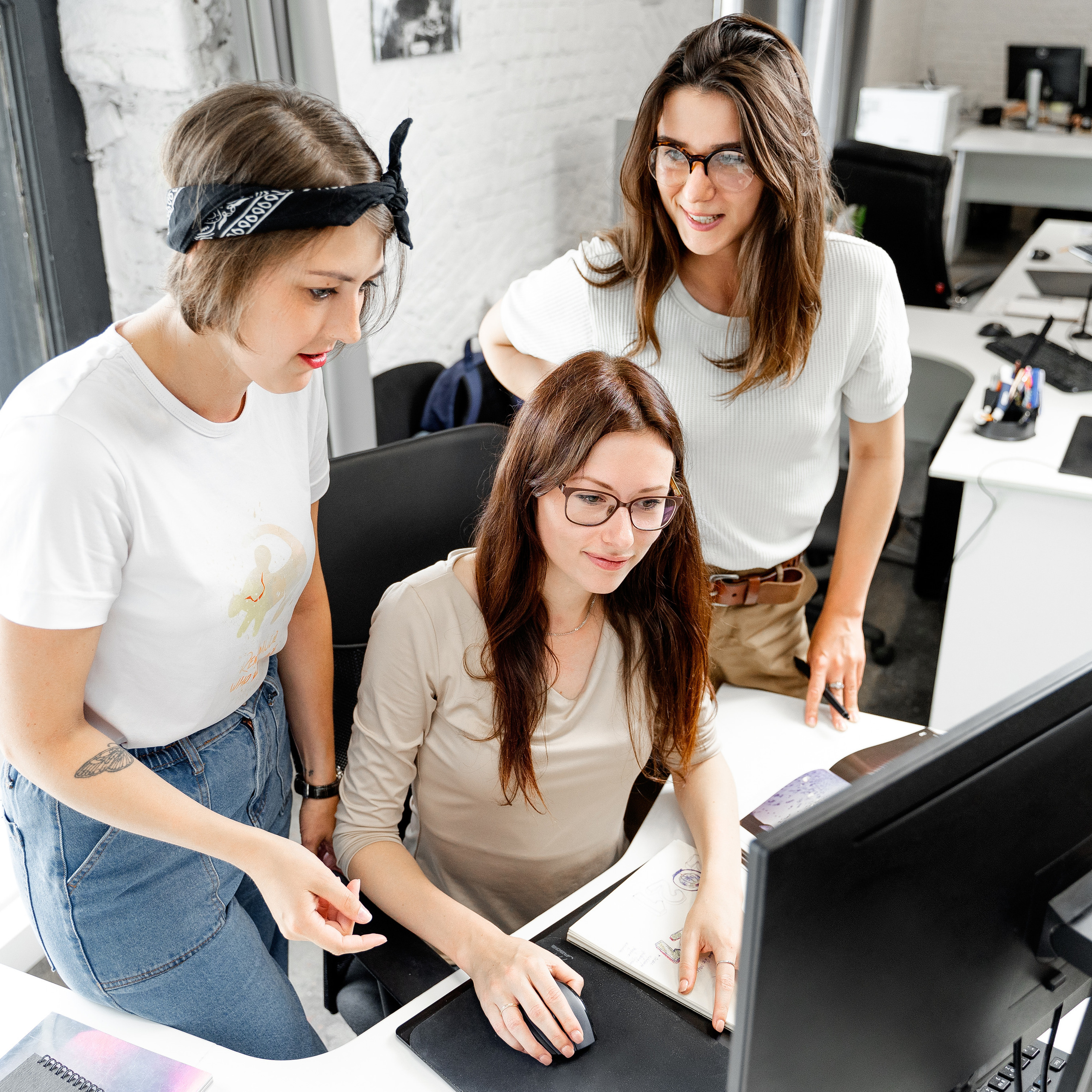Collaborative corporate environment captured by photographer Dmitrii Shmatov, showcasing a dynamic team interaction at the office.
