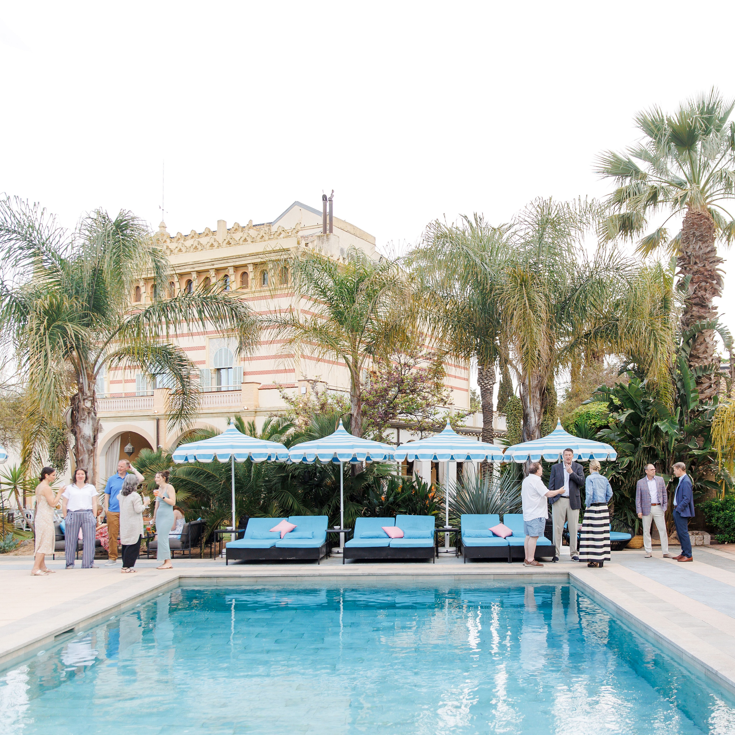 Sincere moment of family reuniting at a rehearsal party at beautiful destination wedding venue in Spain