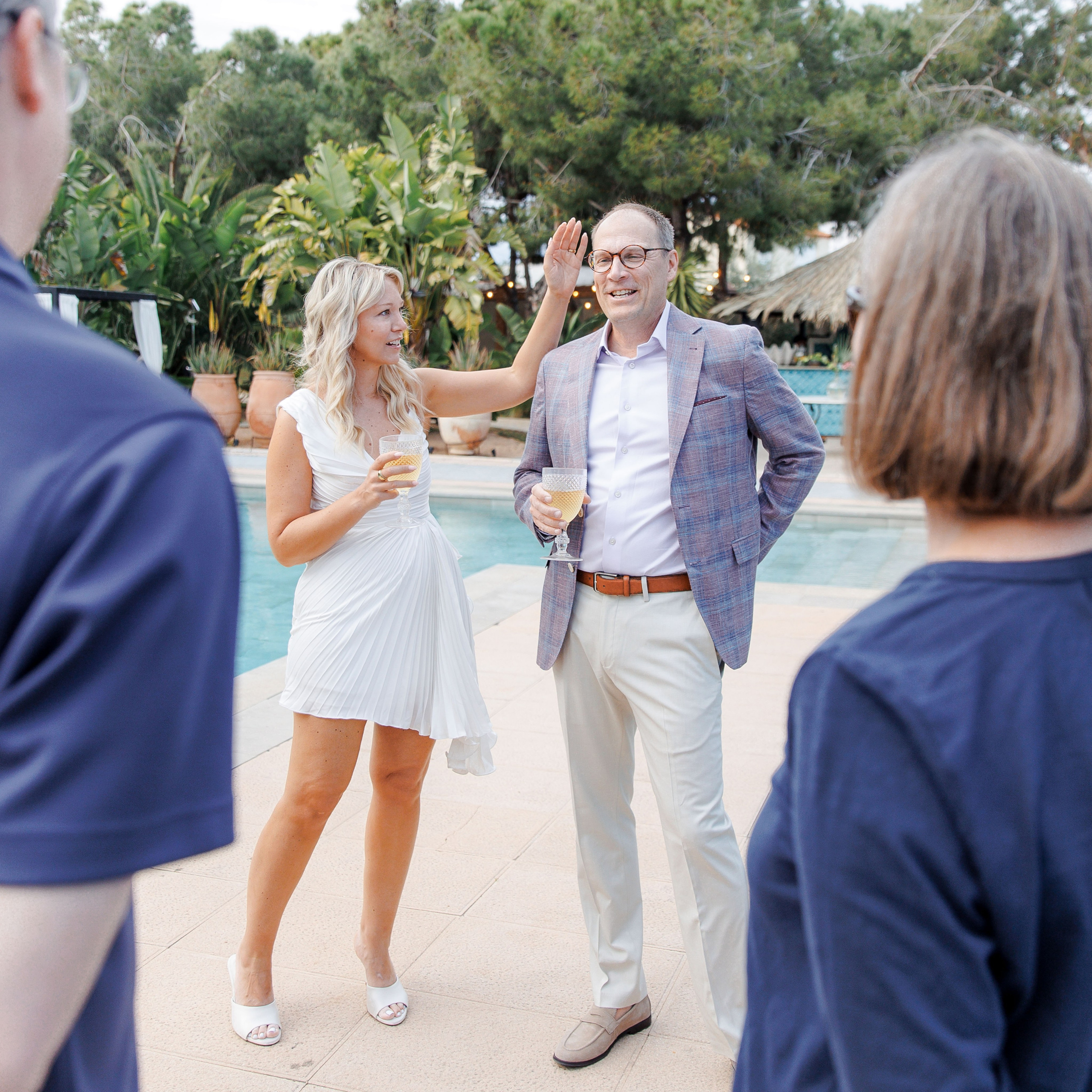 Couple enjoying relaxed moments with family before their wedding day
