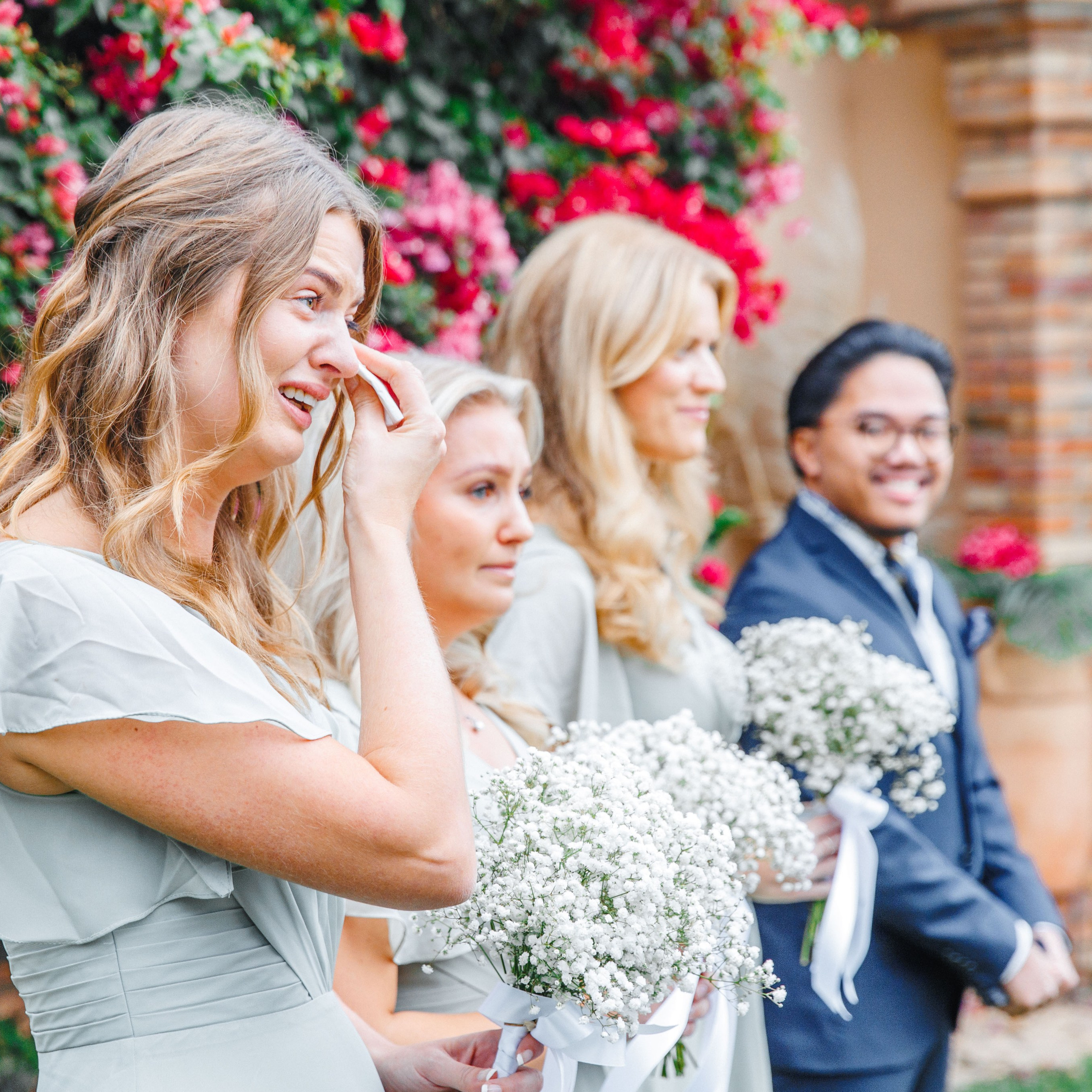 Emotional moment during the wedding ceremony in Barcelona with a bridesmaid crying from happiness