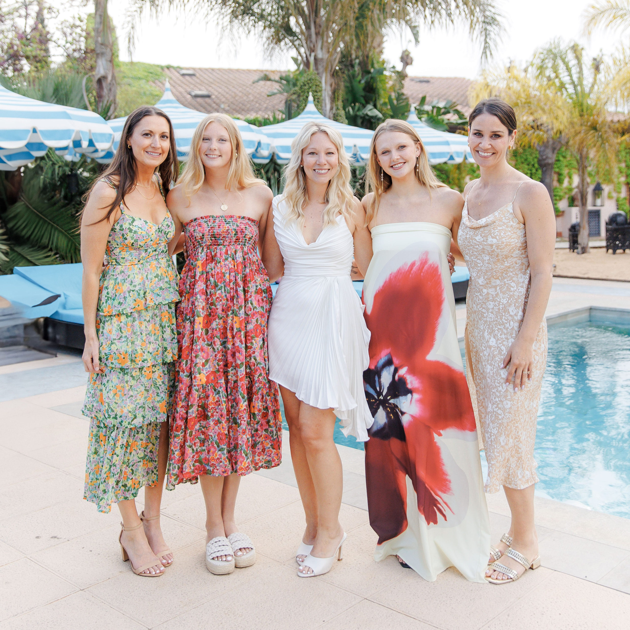 Warm candid portraits of wedding guests at a rehearsal party in Spain