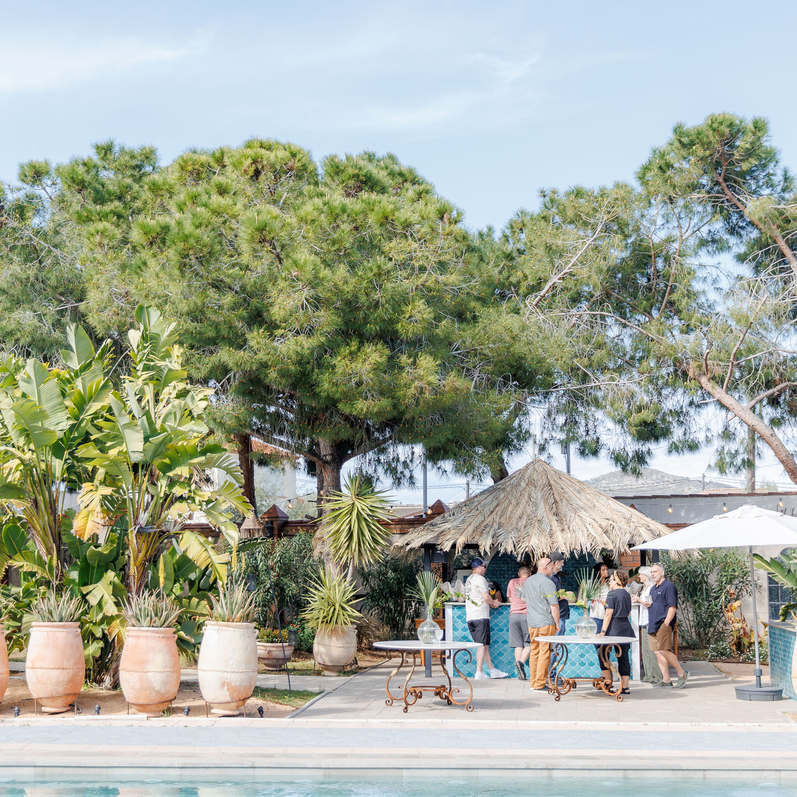 Guests enjoying outdoor rehearsal dinner with Mediterranean charm