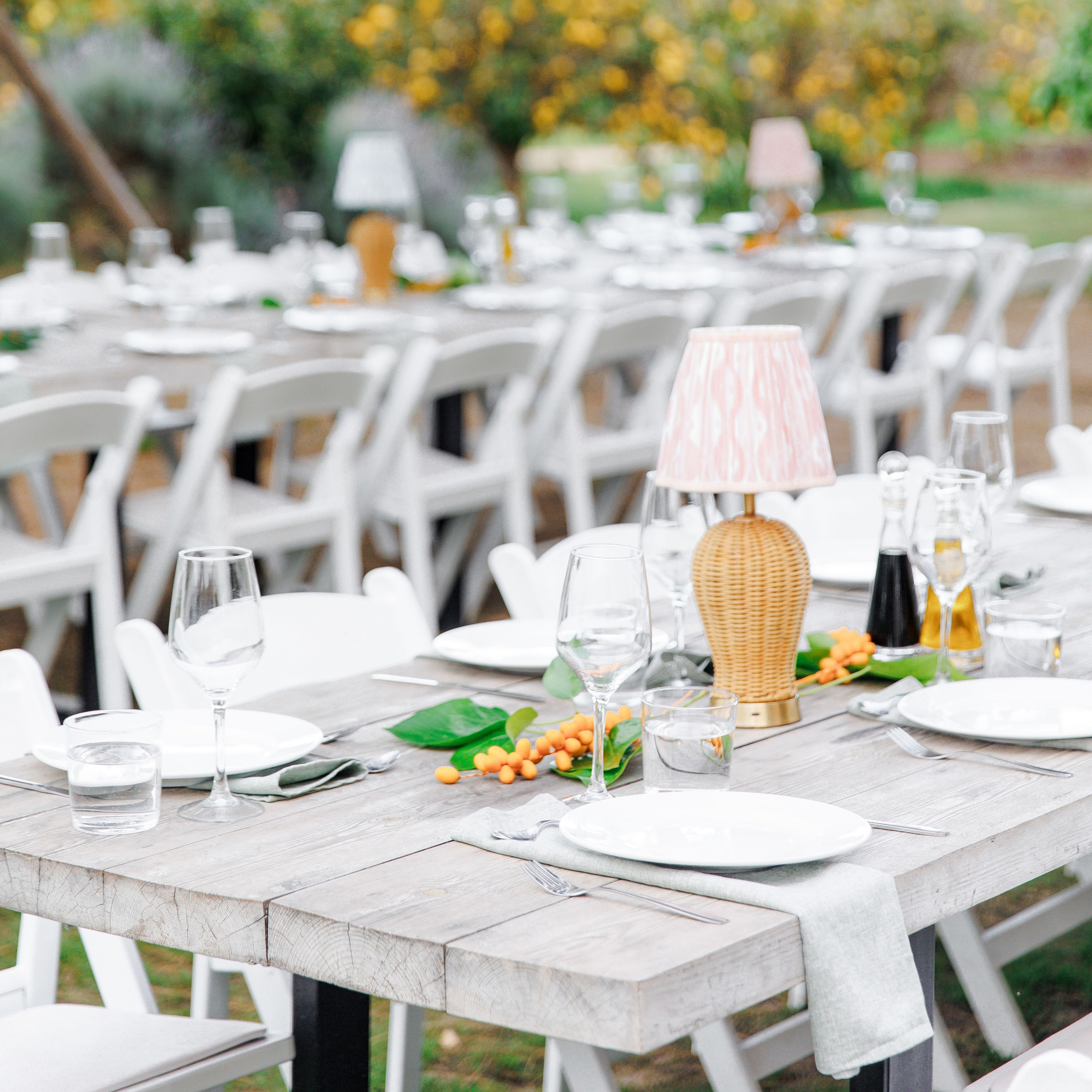 Tables decorated for outdoor rehearsal dinner at Gran Villa Rosa, Sitges