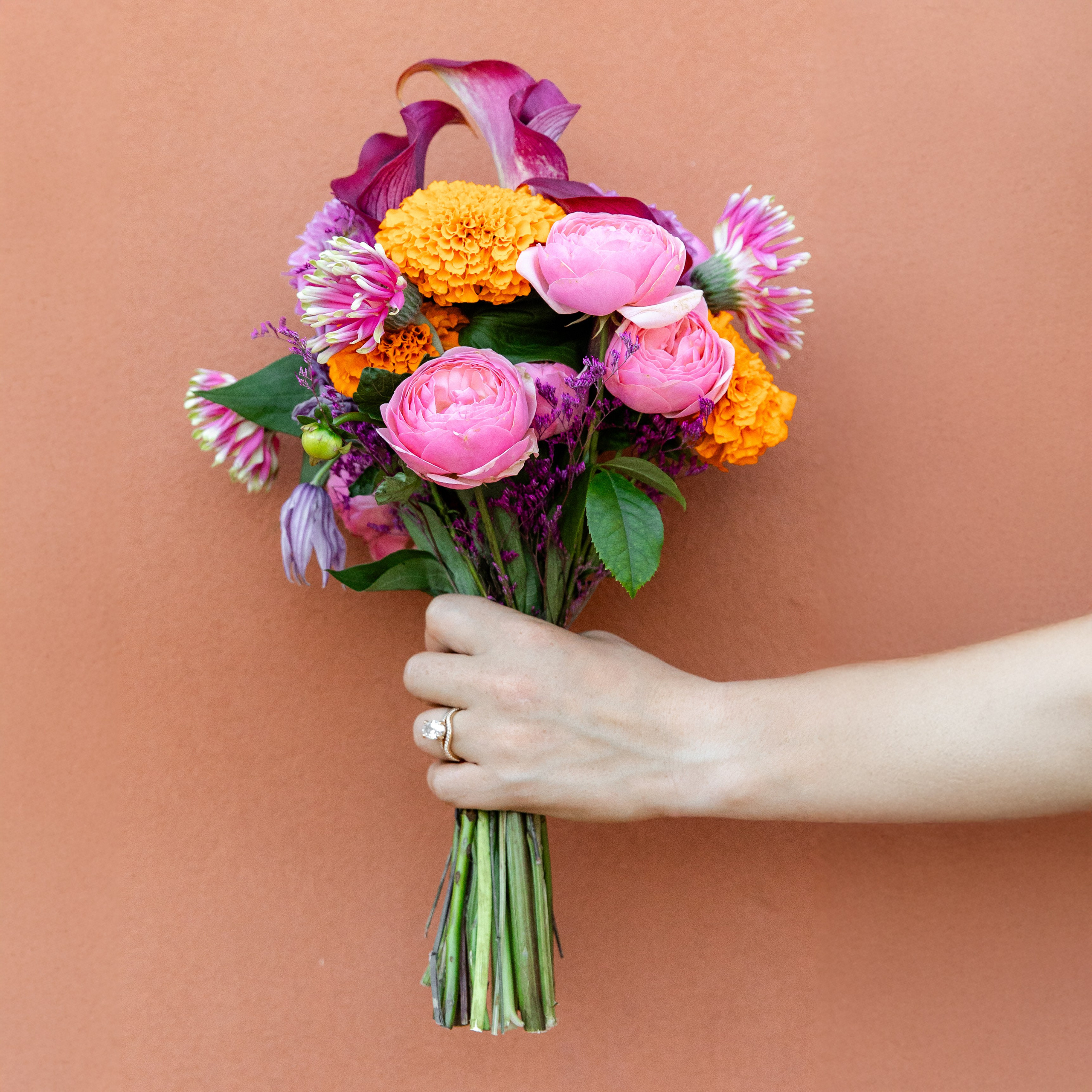 Coloruful bridal bouquet in a summer tones