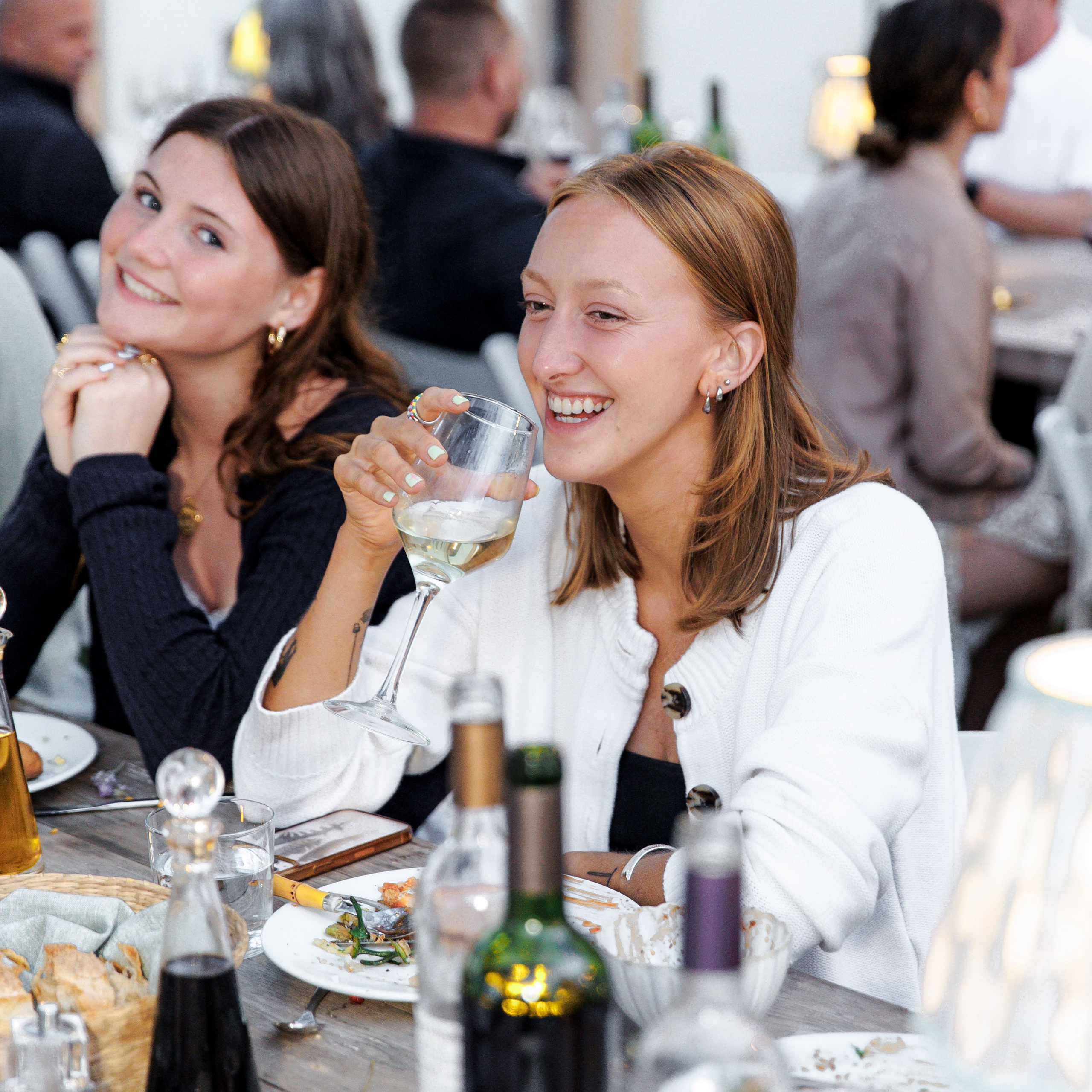 Guests clinking glasses at rehearsal party in Barcelona wedding weekend