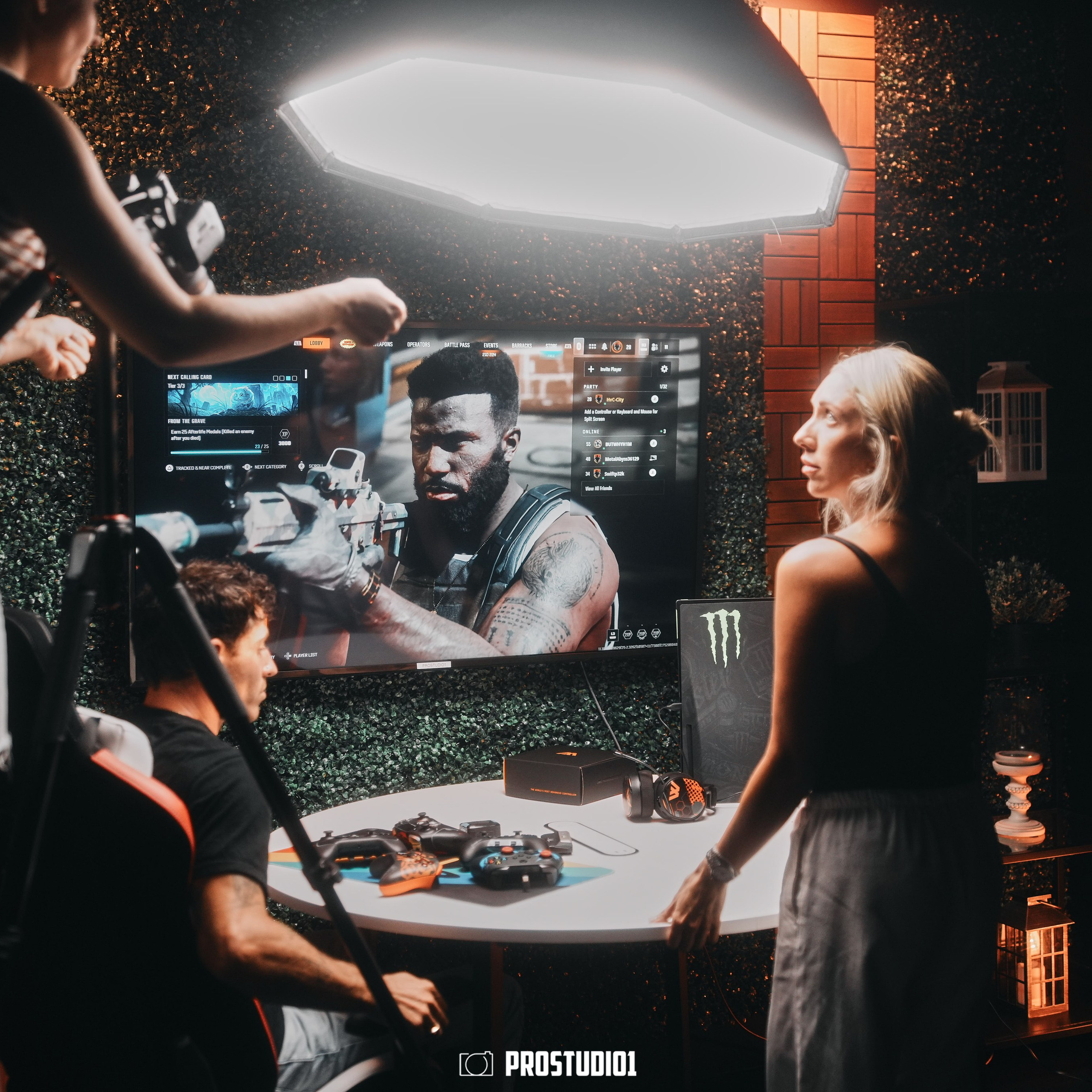 Behind-the-scenes look at ProStudio1 talk-show set in Hollywood, FL — microphones on boom arms and studio lighting setup visible.