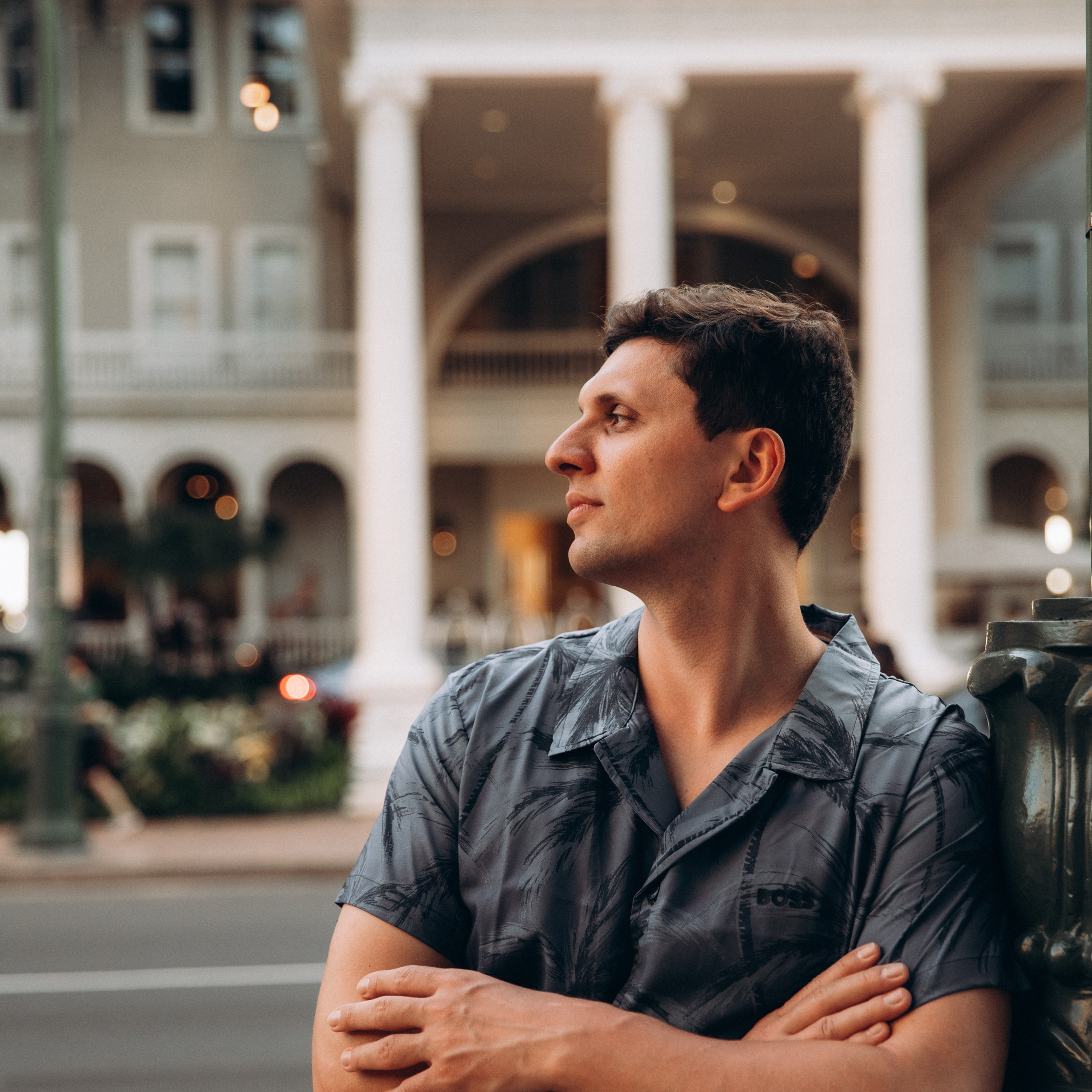 Man in front of Moana Surfrider Hotel in Waikiki, Honolulu