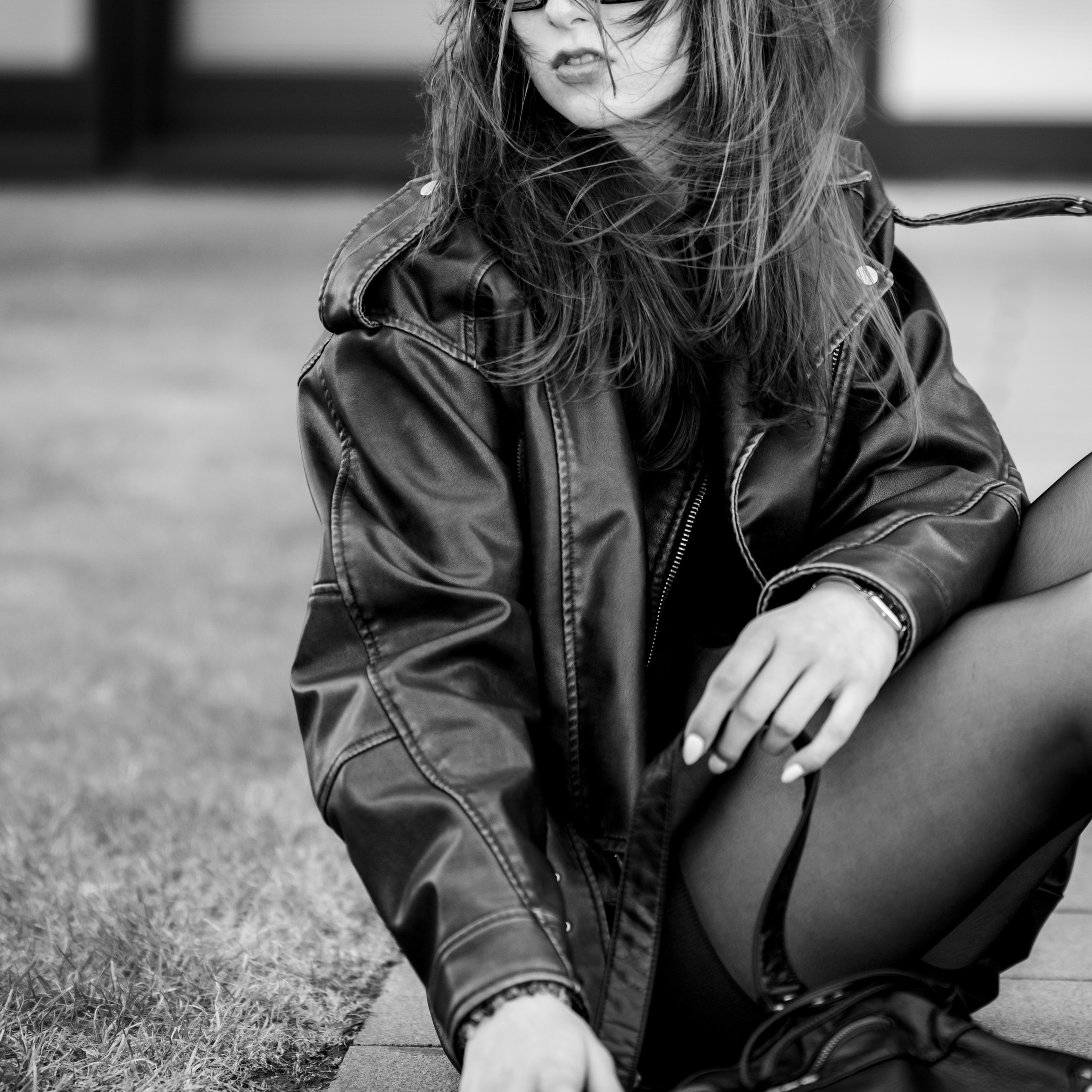 Photoshoot in DusseldorfStreet fashion photographyMedienHafenBlack and white photographyStreet style aestheticGirl in a leather jacketUrban fashion shootDusseldorf lifestyle photography