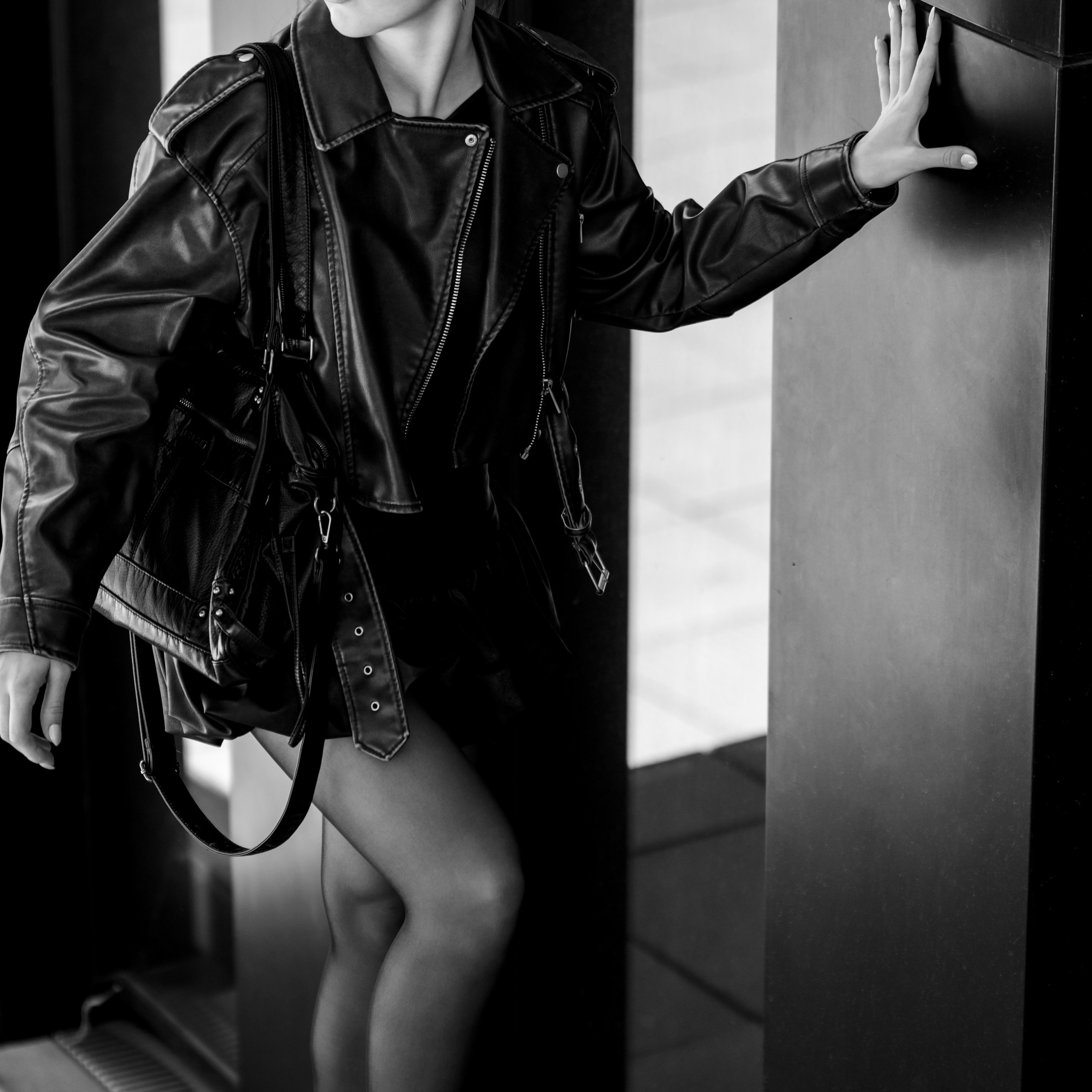 Photoshoot in DusseldorfStreet fashion photographyMedienHafenBlack and white photographyStreet style aestheticGirl in a leather jacketUrban fashion shootDusseldorf lifestyle photography
