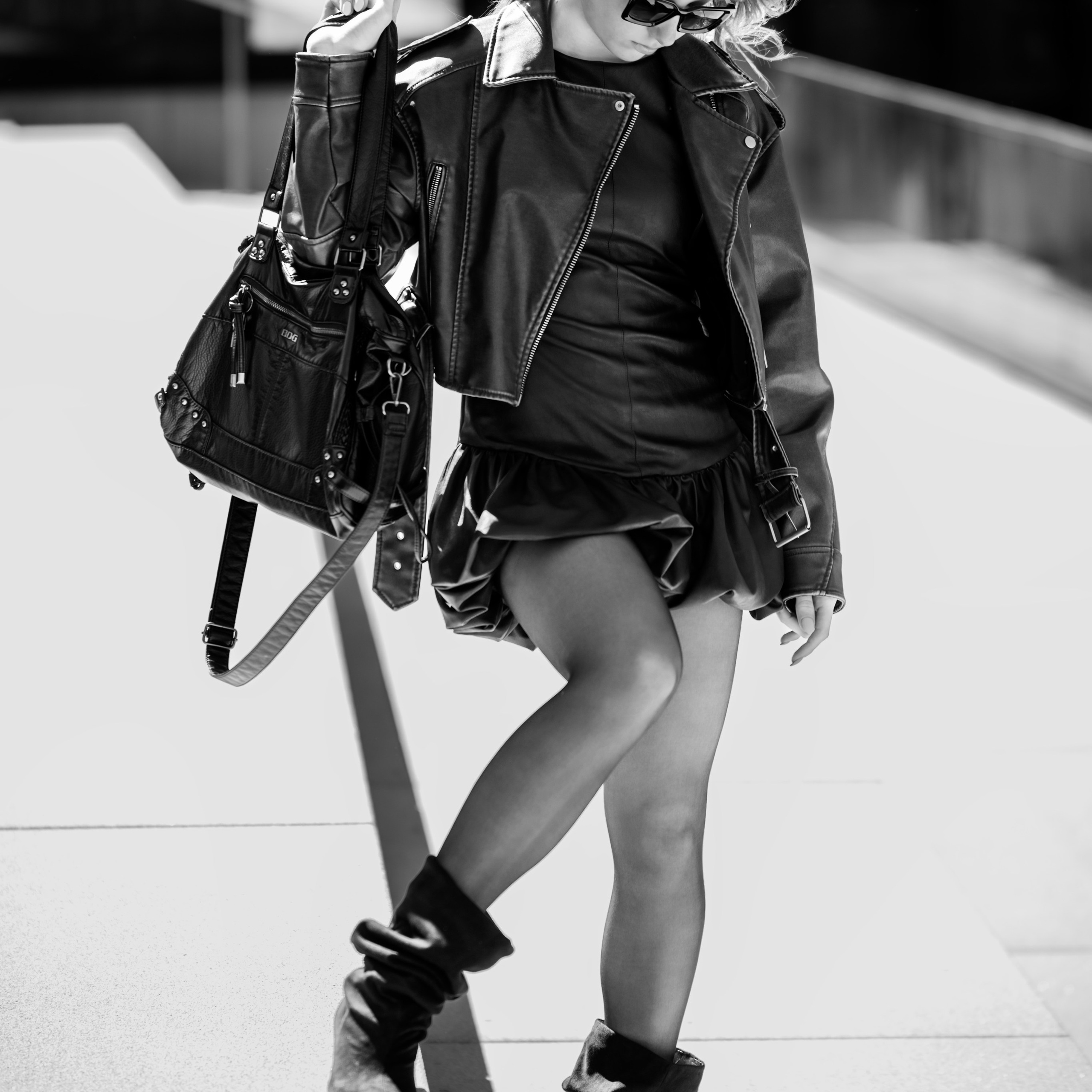 Photoshoot in DusseldorfStreet fashion photographyMedienHafenBlack and white photographyStreet style aestheticGirl in a leather jacketUrban fashion shootDusseldorf lifestyle photography