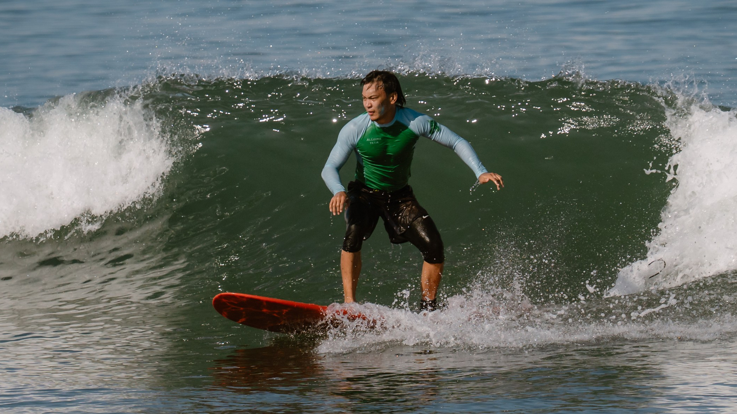 Al Leone athletes having fun surfing in the Pacific Ocean