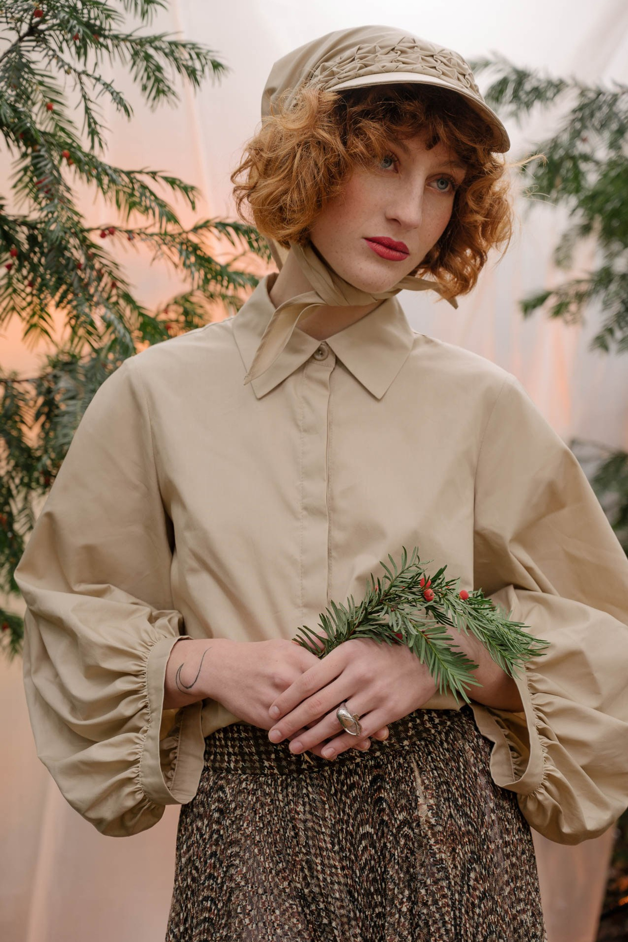 Editorial fashion portrait with soft natural light, neutral tones and classic styling