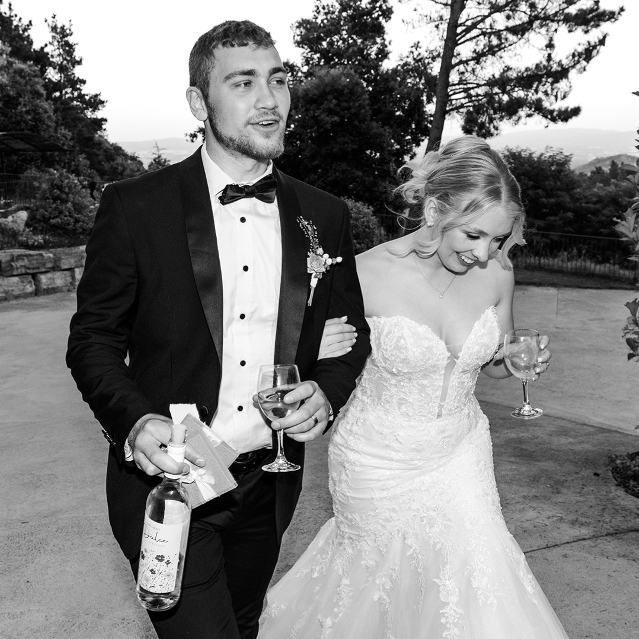 Black and white shot of the groom and bride entering the wedding reception in the Barcelona wedding venue