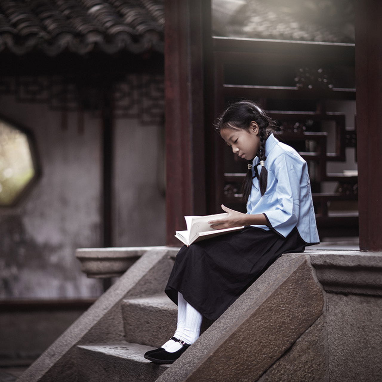 Photo shoot for a girl in a 1960s Chinese school costume, Yu Garden