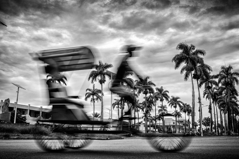 Cycle rickshaw on Avenue de l'Indépendance, Toamasina, Atsinanana region, Toamasina province, Republic of Madagascar. 2014