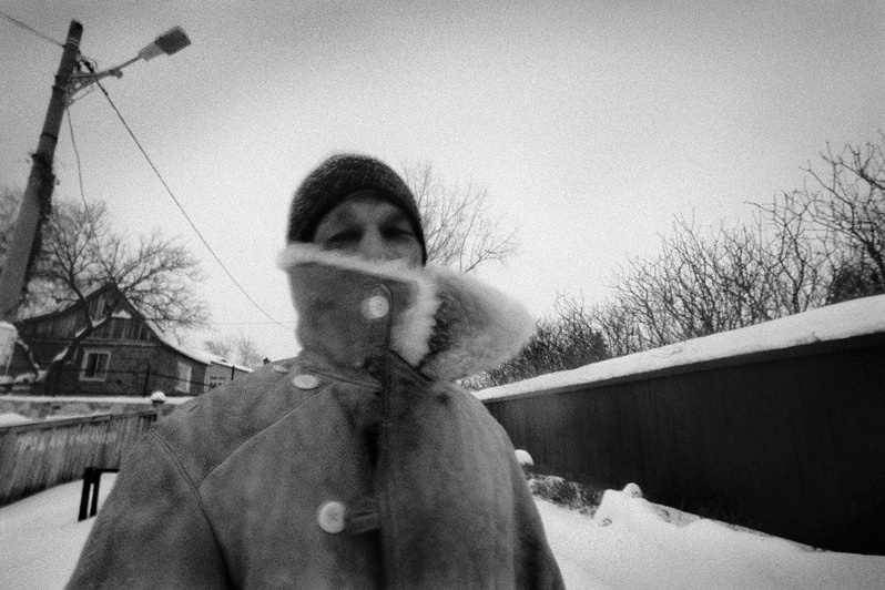 Just a passerby. Evening blizzard, Veshenskaya stanitsa, Rostov-on-Don region, Russia. February 2012