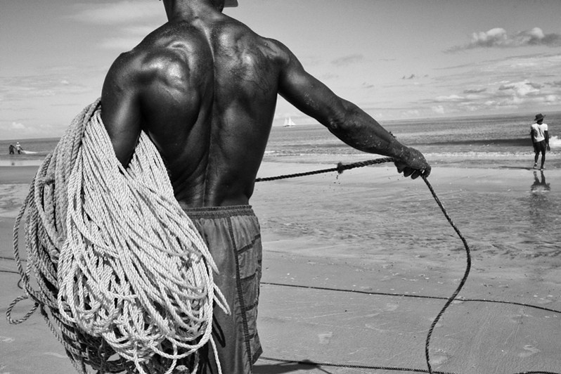 Back fishing net rope puller, near Morondava, Menabe region, Toliara province, Republic of Madagascar. 2013