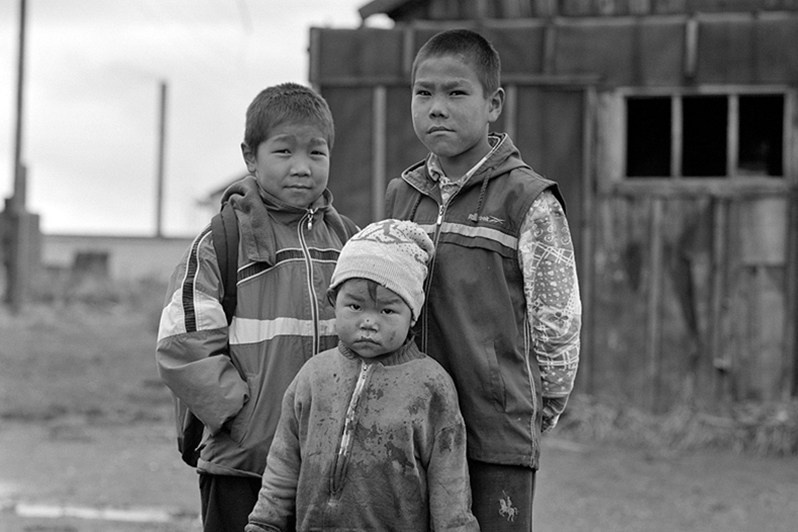 Three comrades, Lorino settlement, Chukotka, Russia. September 2007
