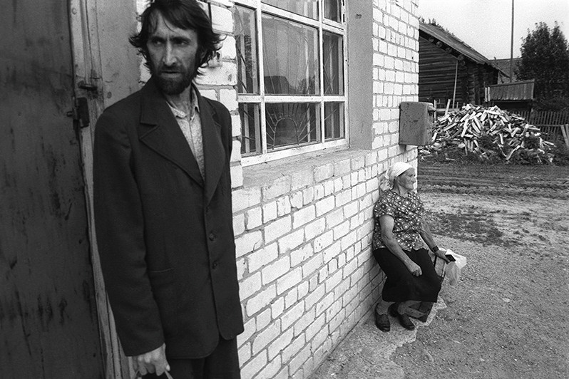 While waiting for the shop to open, Krasnaya Niva village, Chukhlomskiy district, Kostroma region, Russian SFSR. July 1990