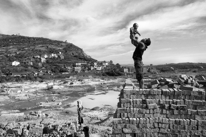 Father and son on a brick kiln, Fianarantsoa, Republic of Madagascar. 2016