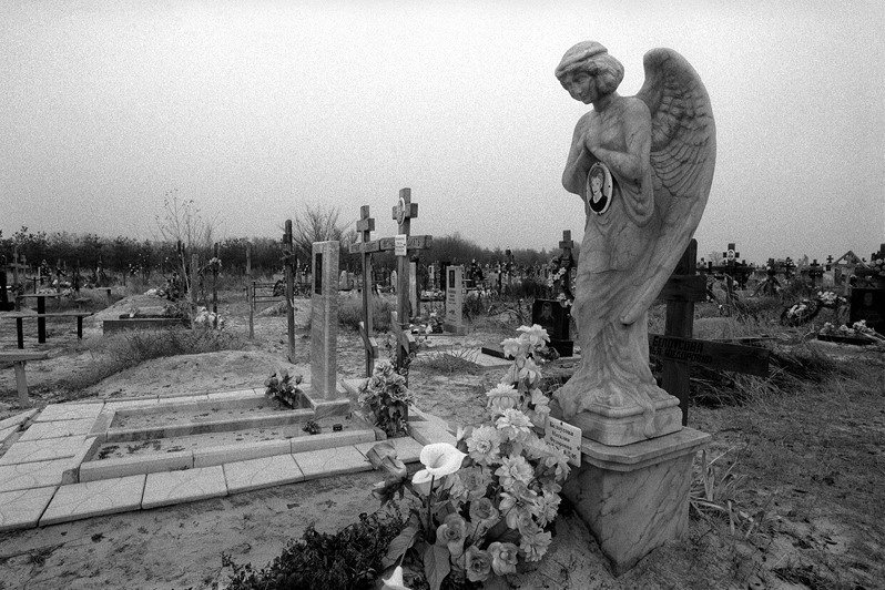 Tombstone sculpture of an angel on a cemetery in Surovikino, near Surovikino, Volgograd region, Russia. November 2010