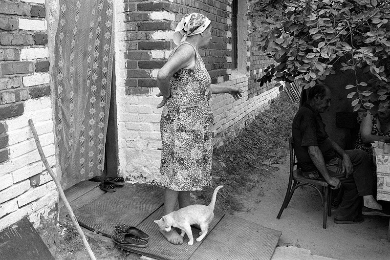 At owner’s feet, Senshin khutor, Oblivsky district, Rostov-on-Don region, Russia. July 2010