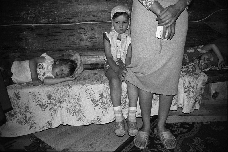 "Rest on a bench during a long service", village of Pogost, Pudozh district, Karelia, Russia, January 2009