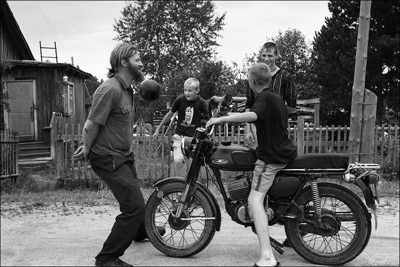 "Gathering for evening soccer", village of Pogost, Pudozh district, Karelia, Russia, August 2007
