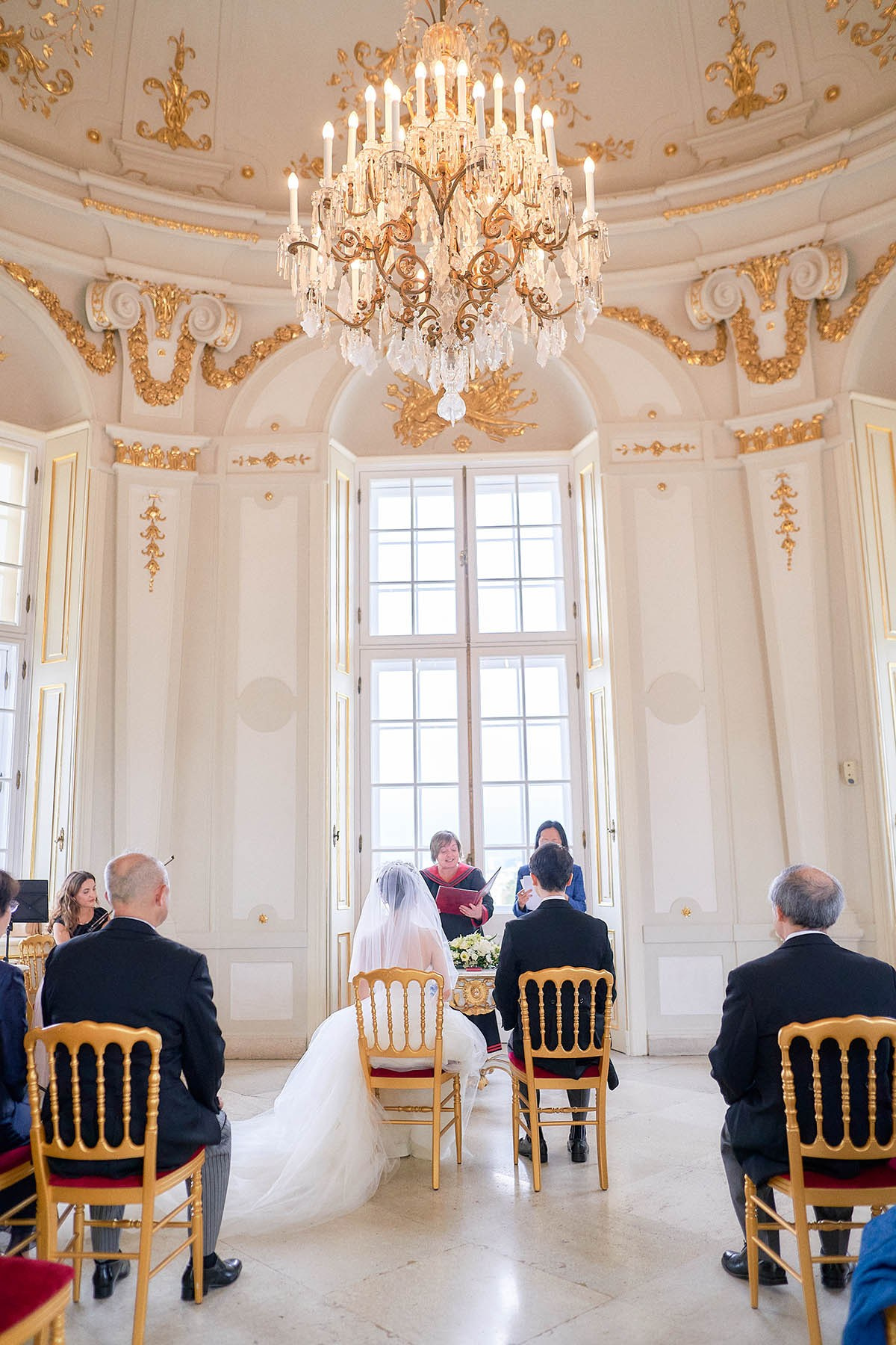 Under the imperial chandeliers.