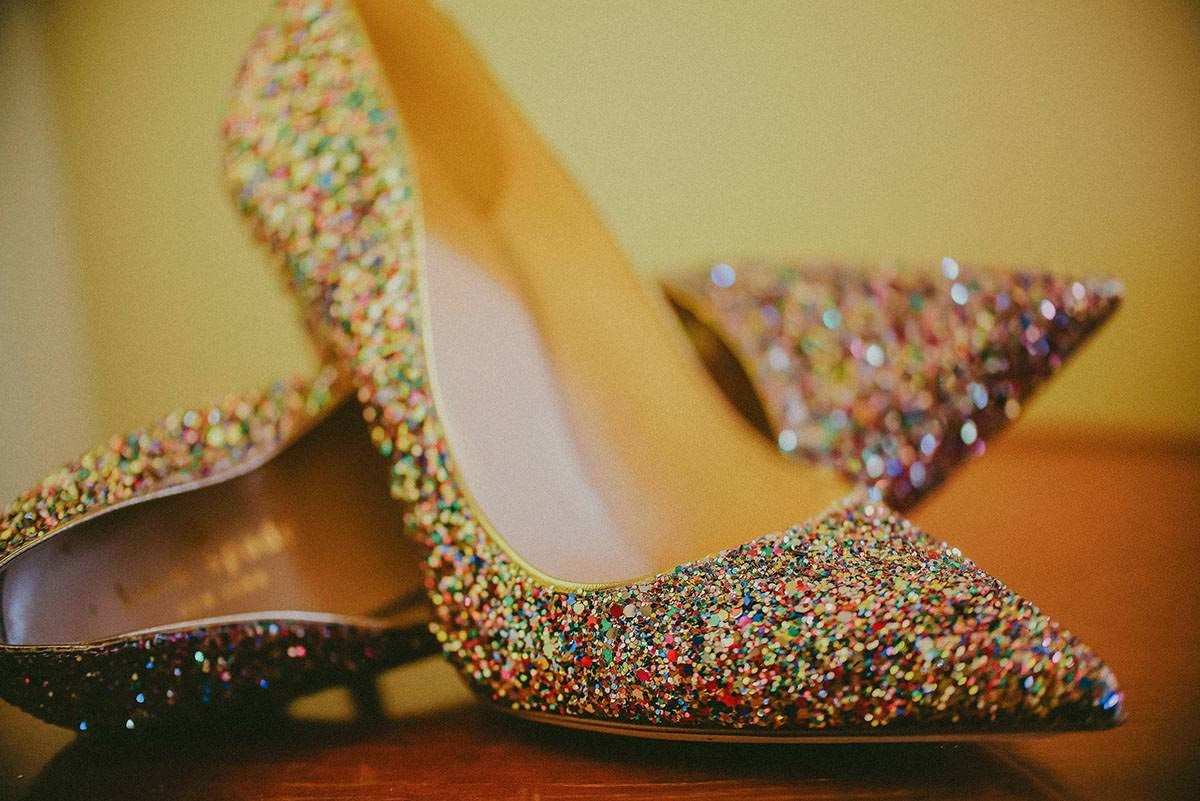 Bride’s sparkling wedding shoes in the bridal suite overlooking Vrtba Garden