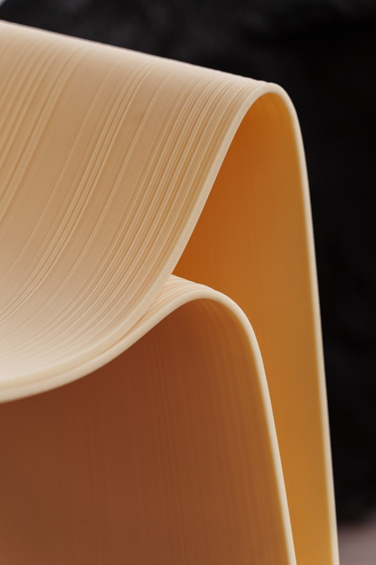 Minimalist product photography in Milan showcasing elegant curved form and material texture