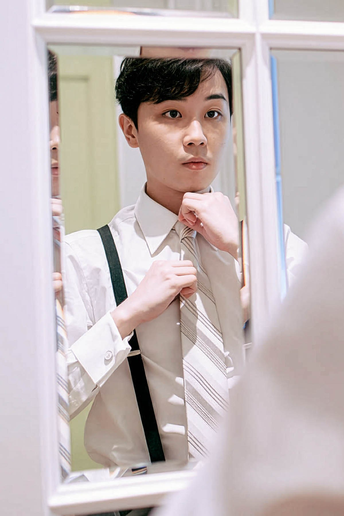 A few final adjustments before leaving the suite.