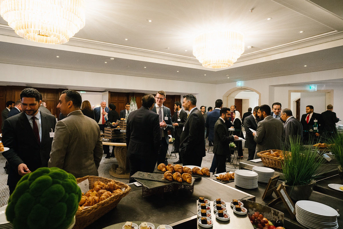 Networking reception with buffet and guests conversing during the conference break