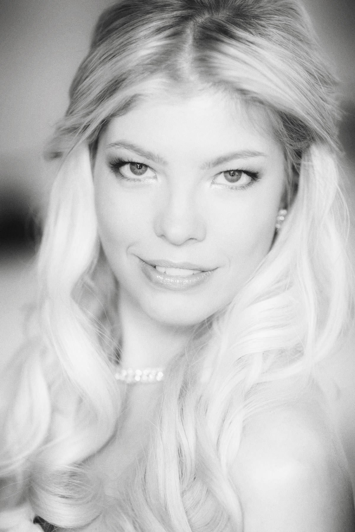 Black and white portrait of radiant bride Julia after makeup at Augustine Hotel Prague