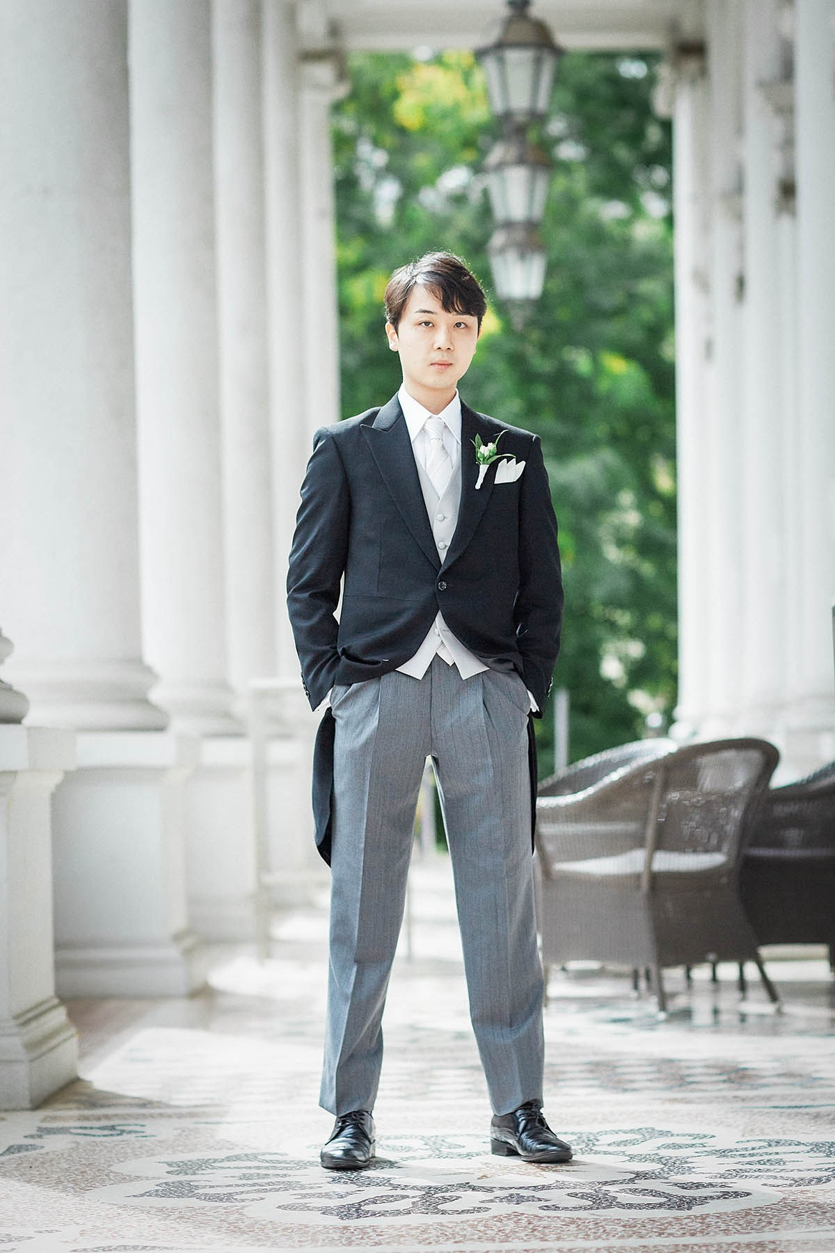 Groom portrait on balcony at Palais Coburg Vienna.
