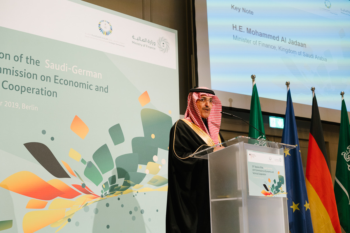 An official delivers a speech at a conference podium