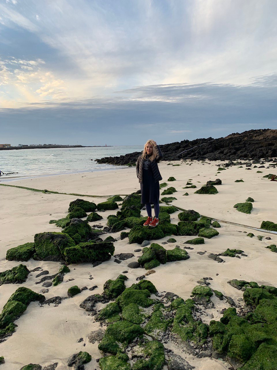 blond girl on the beach in jedju island