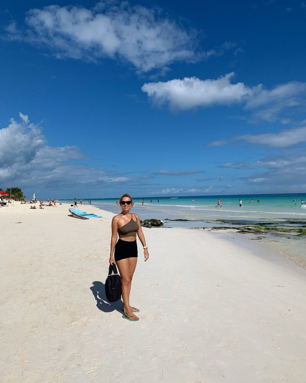 woman on the beach in Tulum in playa paraiso
