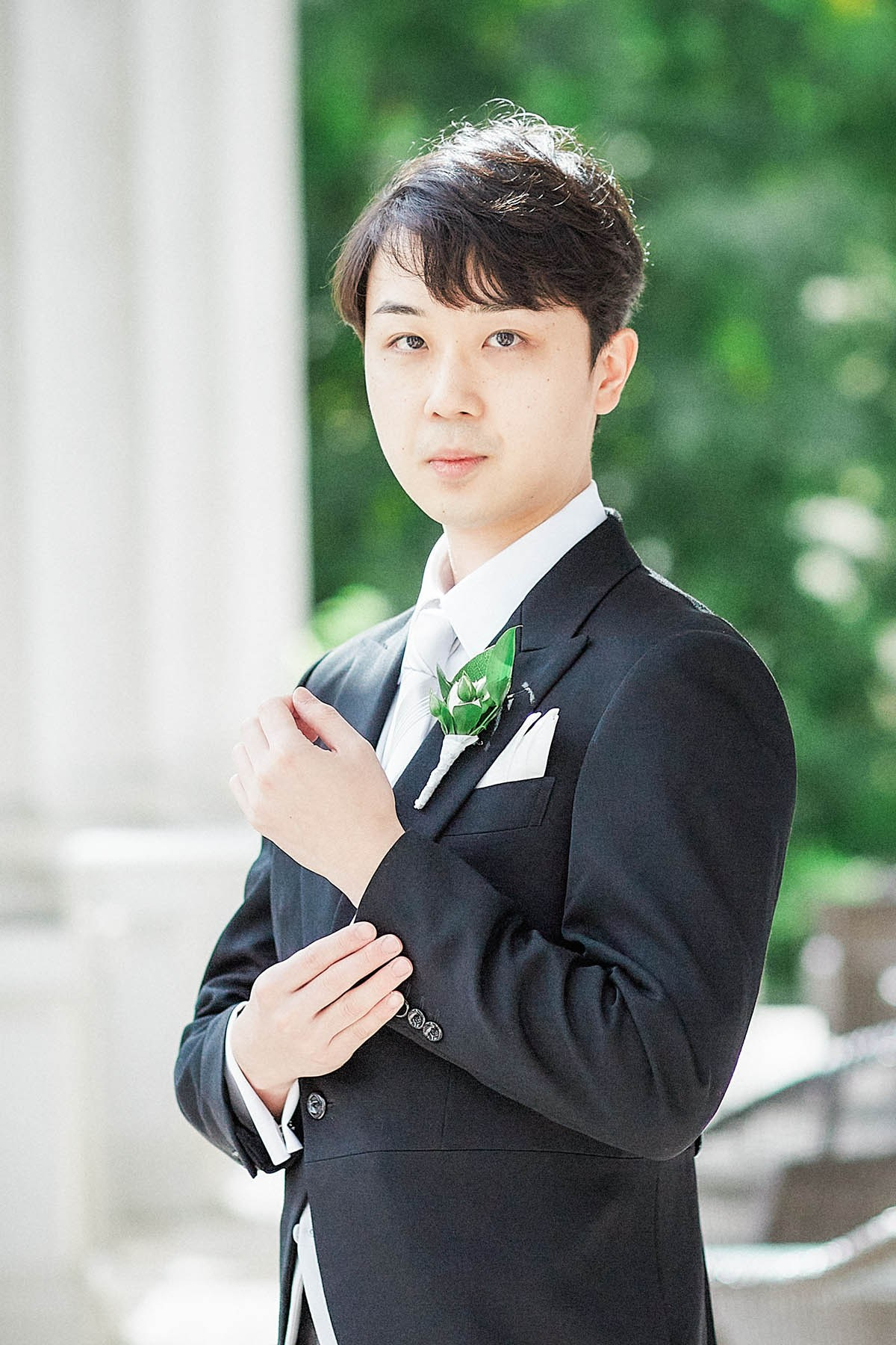 Groom portrait on balcony at Palais Coburg Vienna.
