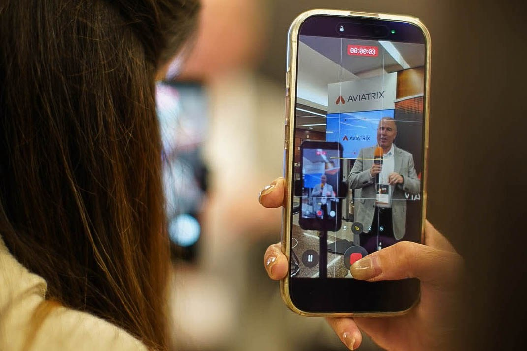 An iPhone captures a video interview of a speaker at a sales kick-off event at the Hilton Hotel in Prague.