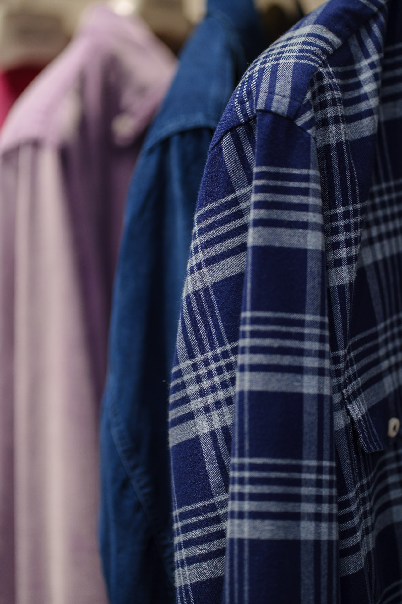 Detail shot of a vibrant fuchsia corduroy shirt, highlighting the fine texture and high-quality Italian craftsmanship.