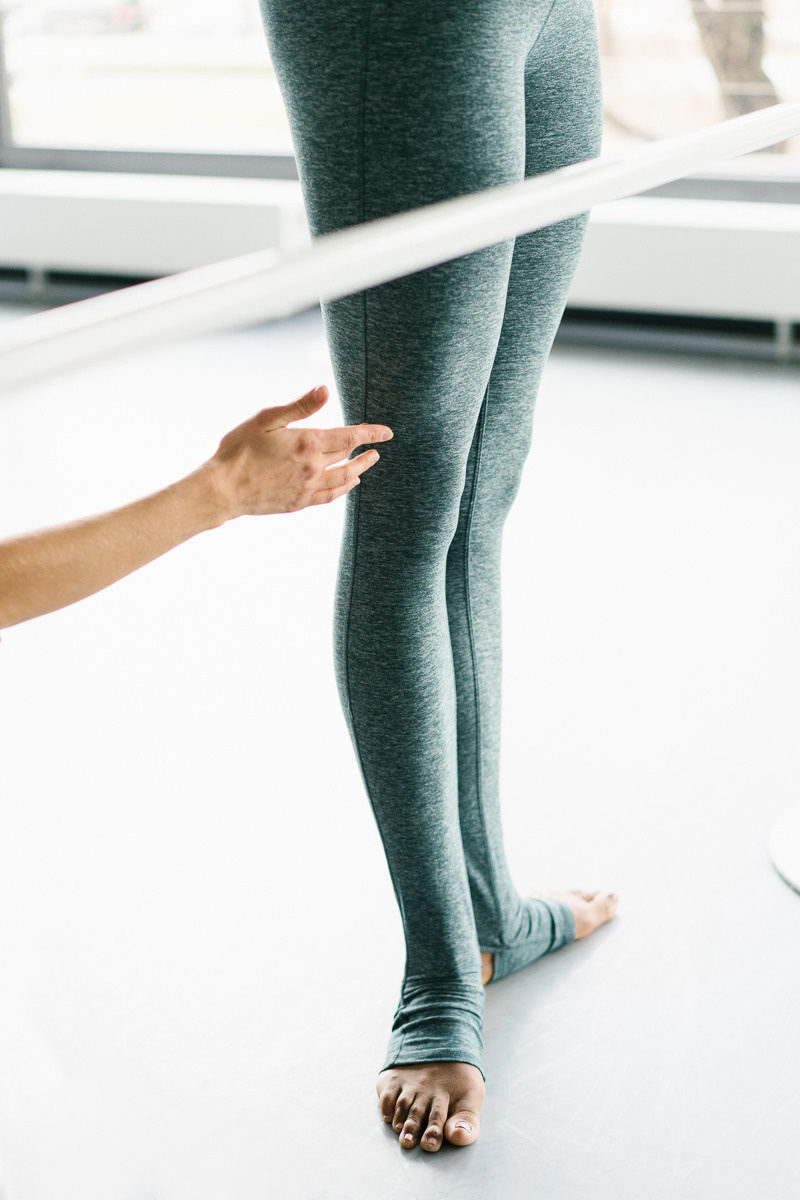 Trainer check the barre ballet pose