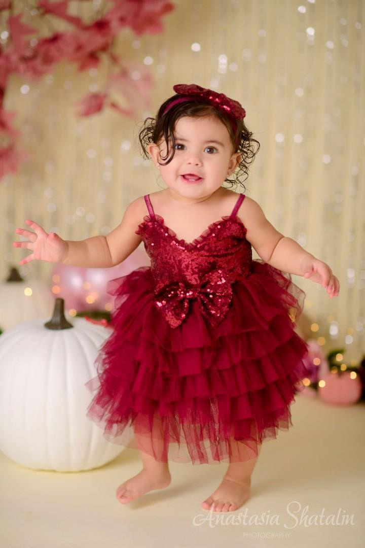 Pumpkins glamourous burgundy pink sparkling cake smash photo shoot. Family photographer in Roseville, Rocklin, Folsom, Sacramento