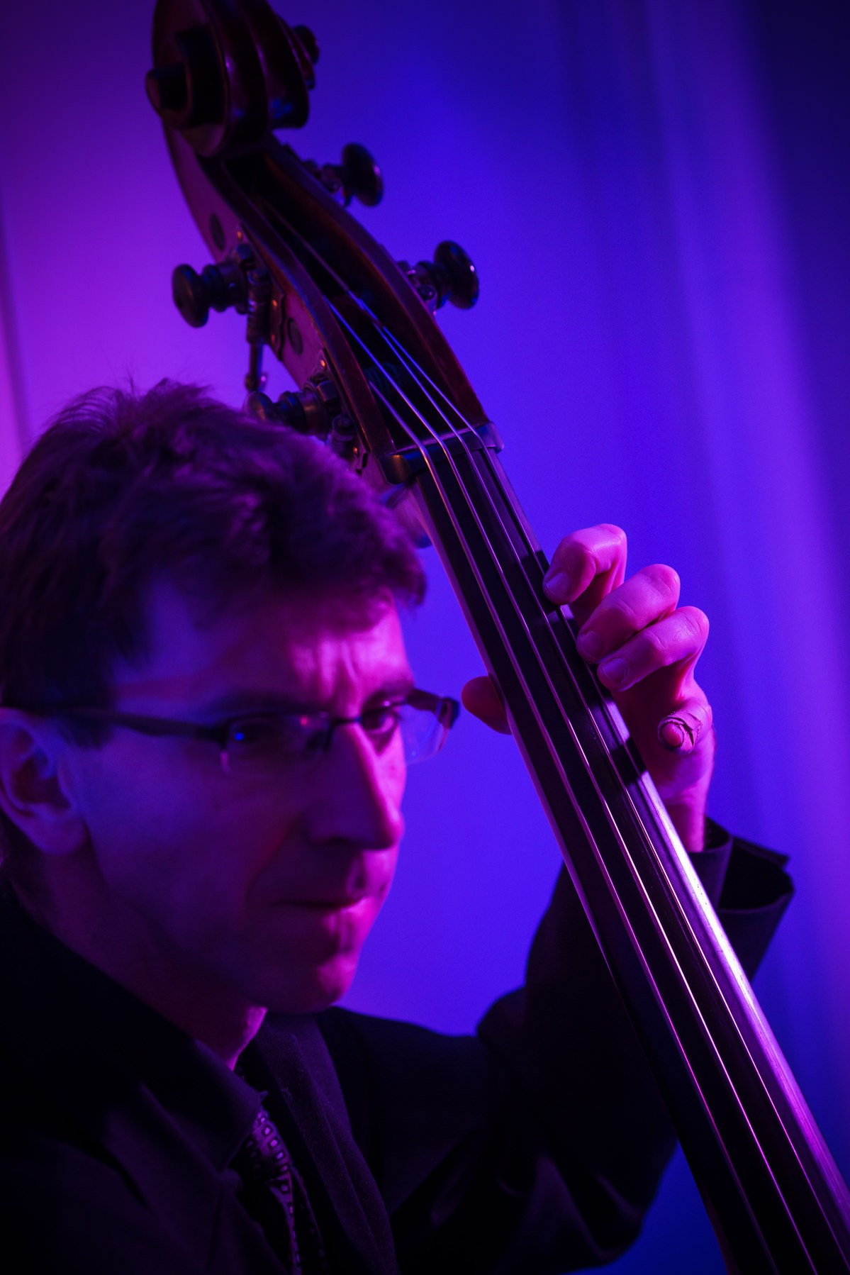 Bass player hands detail jazz performance wedding reception Prague
