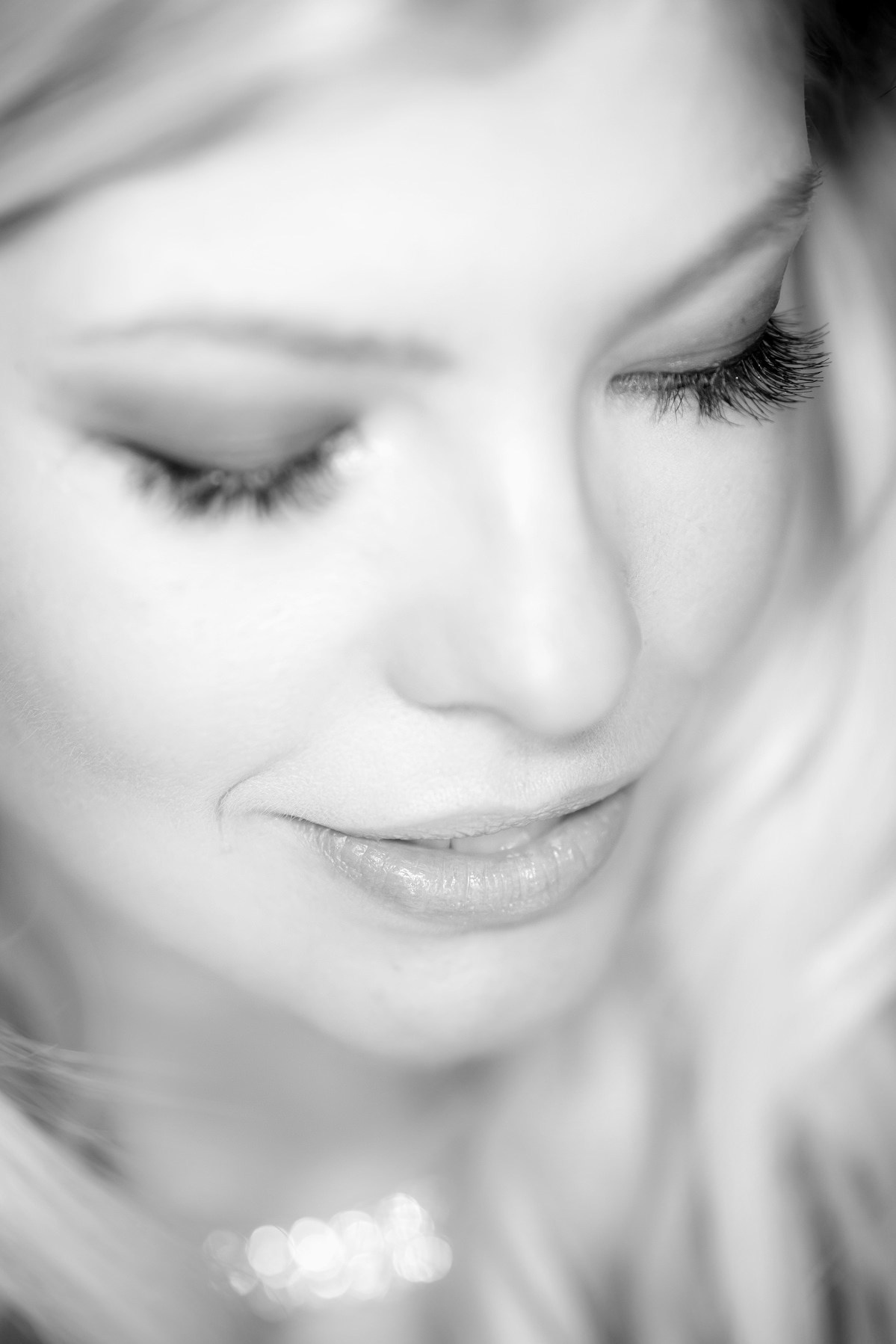 Monochrome bridal portrait of Julia looking away softly at luxury hotel in Prague