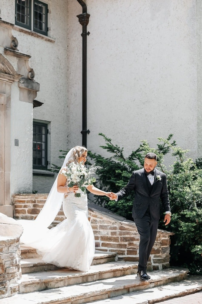 Candid wedding photography of the couple exchanging vows in a picturesque Ottawa location.