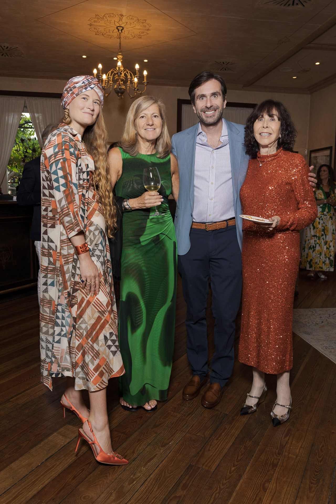 Group of elegantly dressed people at a corporate gala dinner in Milan, showcasing event atmosphere and networking.