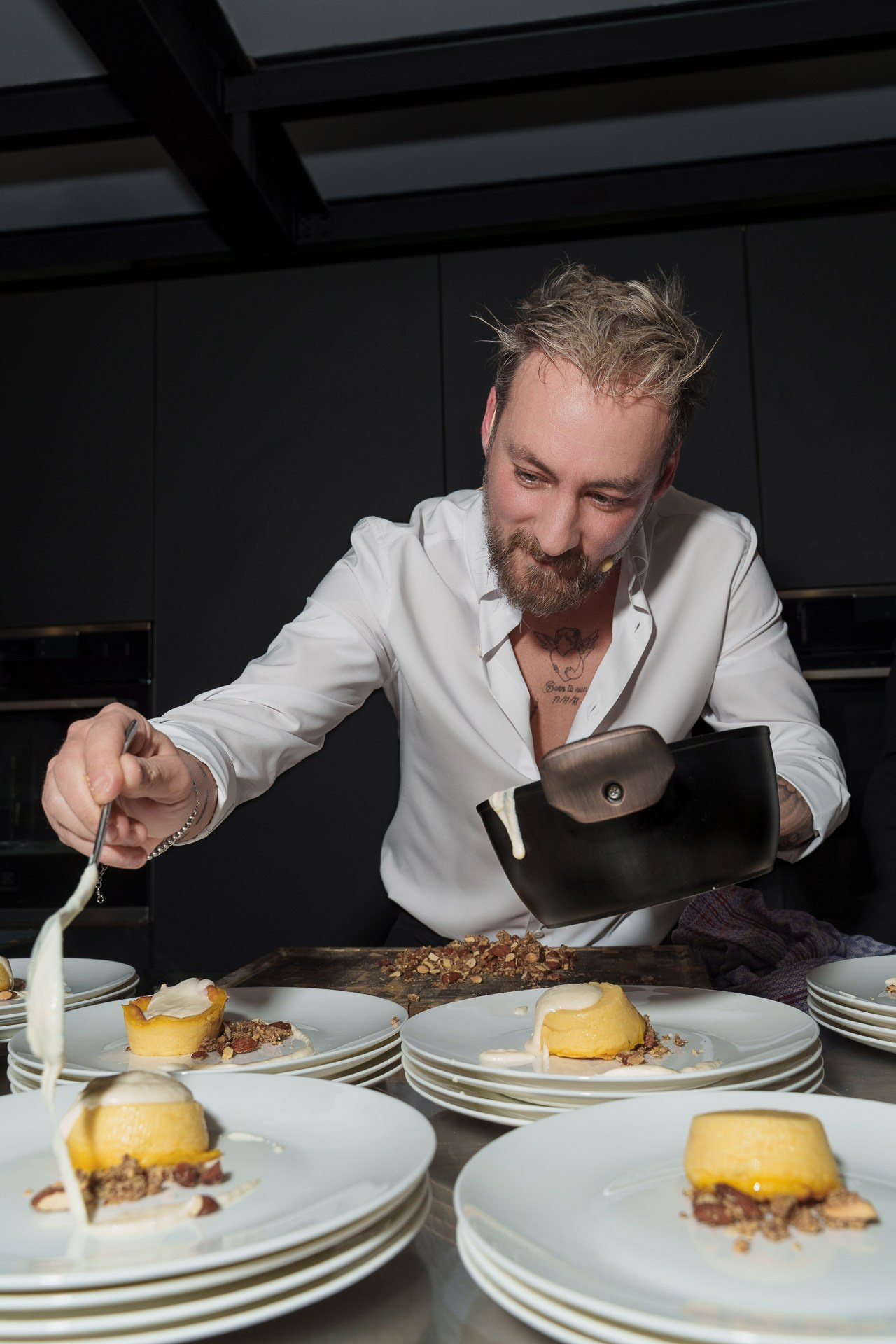 Professional culinary presentation and catering event photography during a high-end corporate reception in Milan.